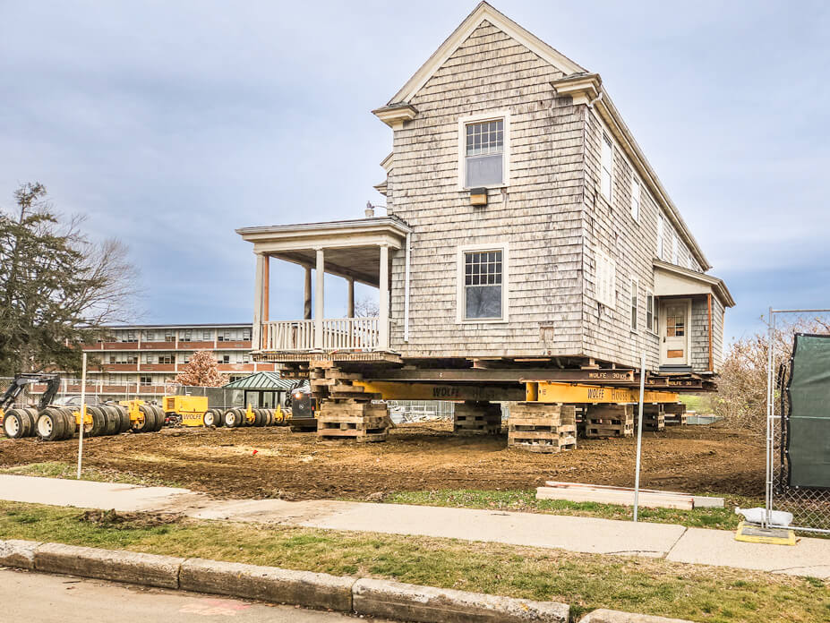 A University of Connecticut building sits on crib piles in preparation for relocation