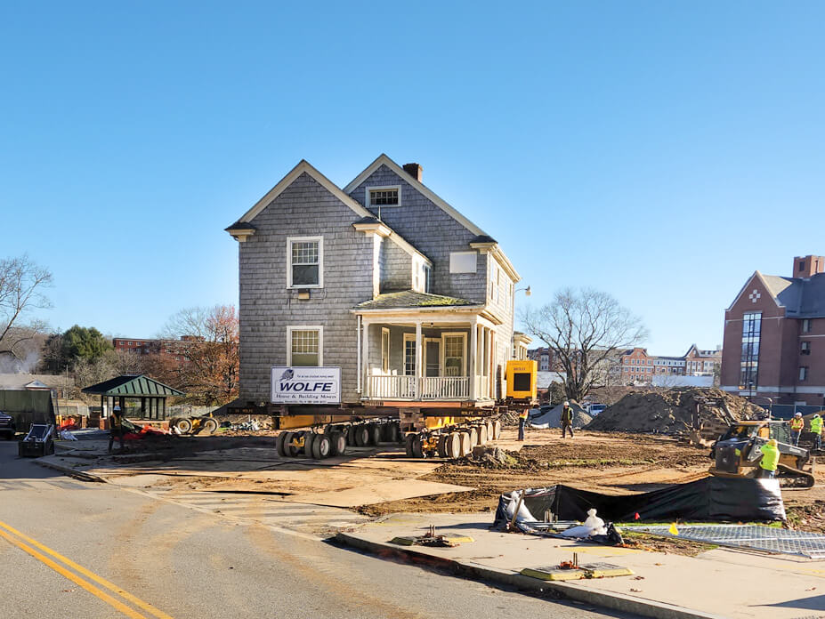 A Uconn house sits on dollies during house move