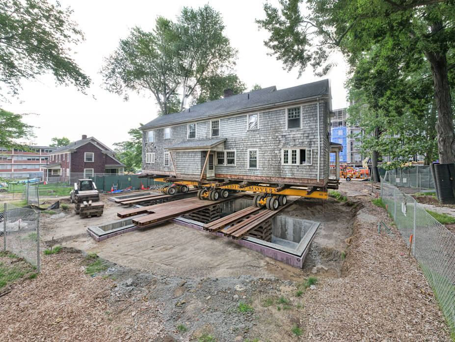 Wolfe House Movers slides UConn house on steel beams over foundation