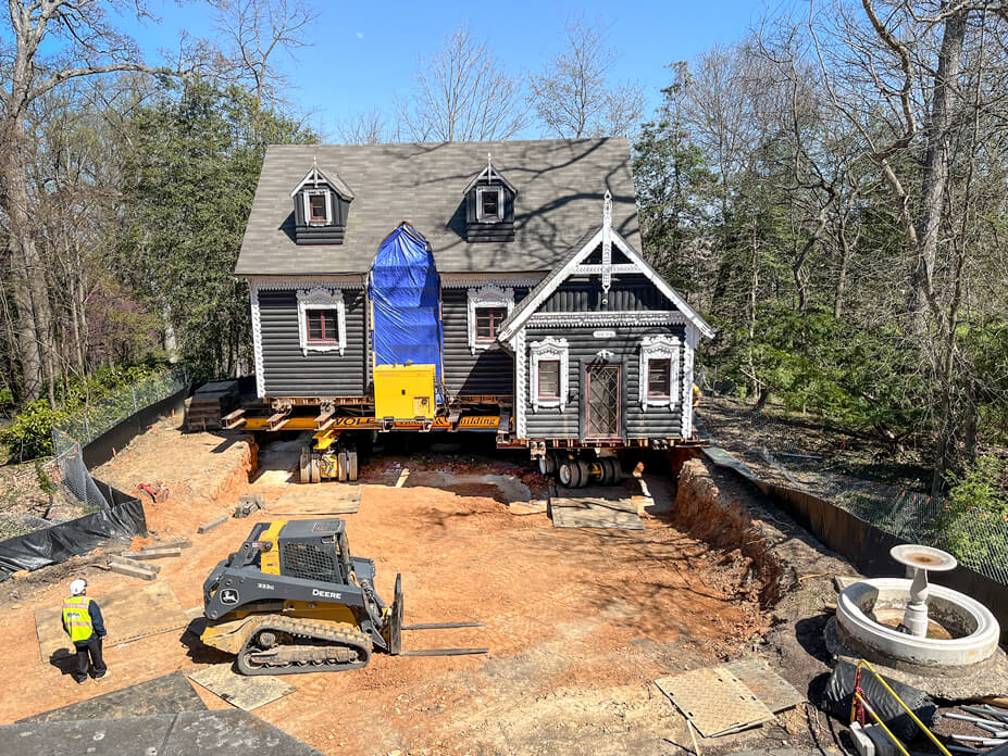 View of dacha on dollies in place over its new foundation