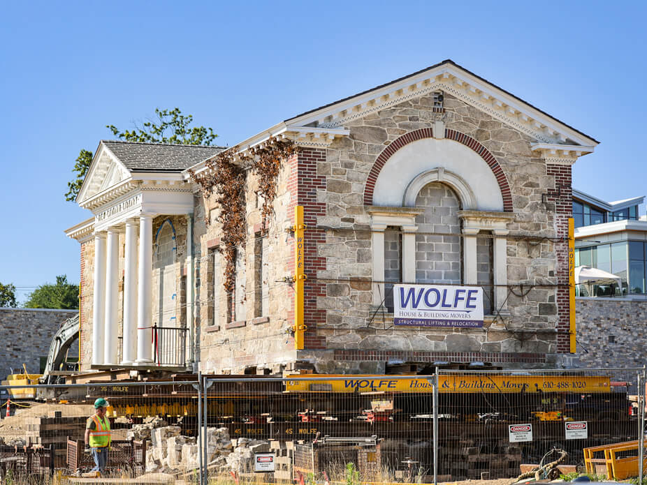 Stone & Brick historic building sits on crib and steel