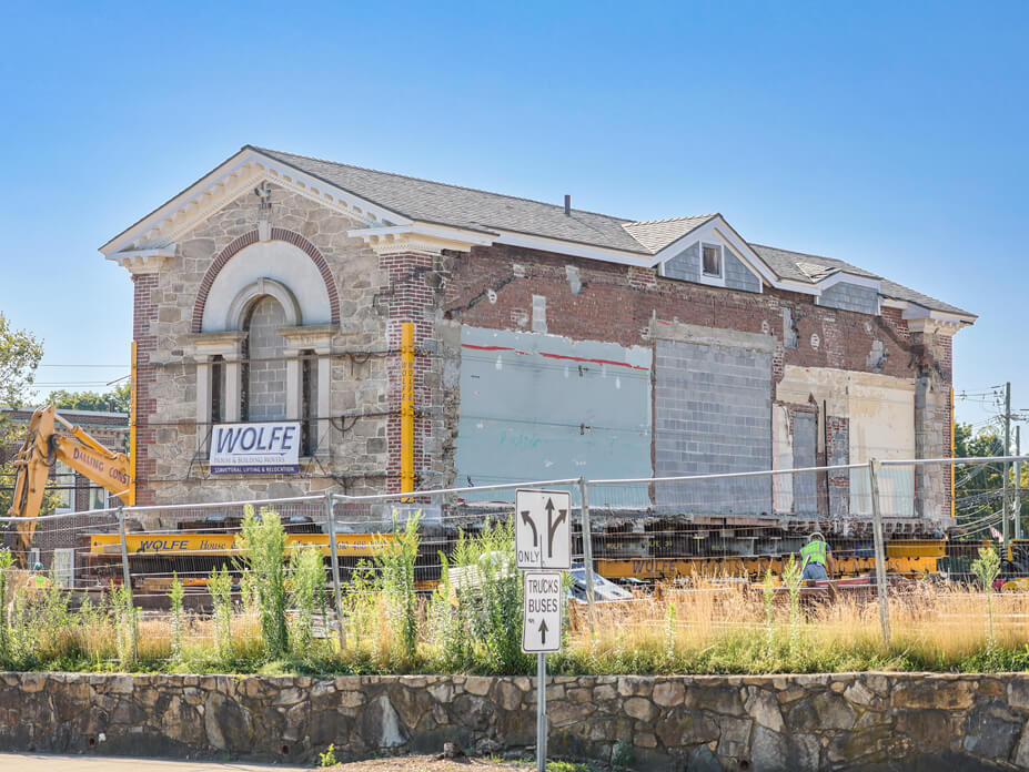 Rear view of historic New Canaan building sitting on Wolfe House Movers steel