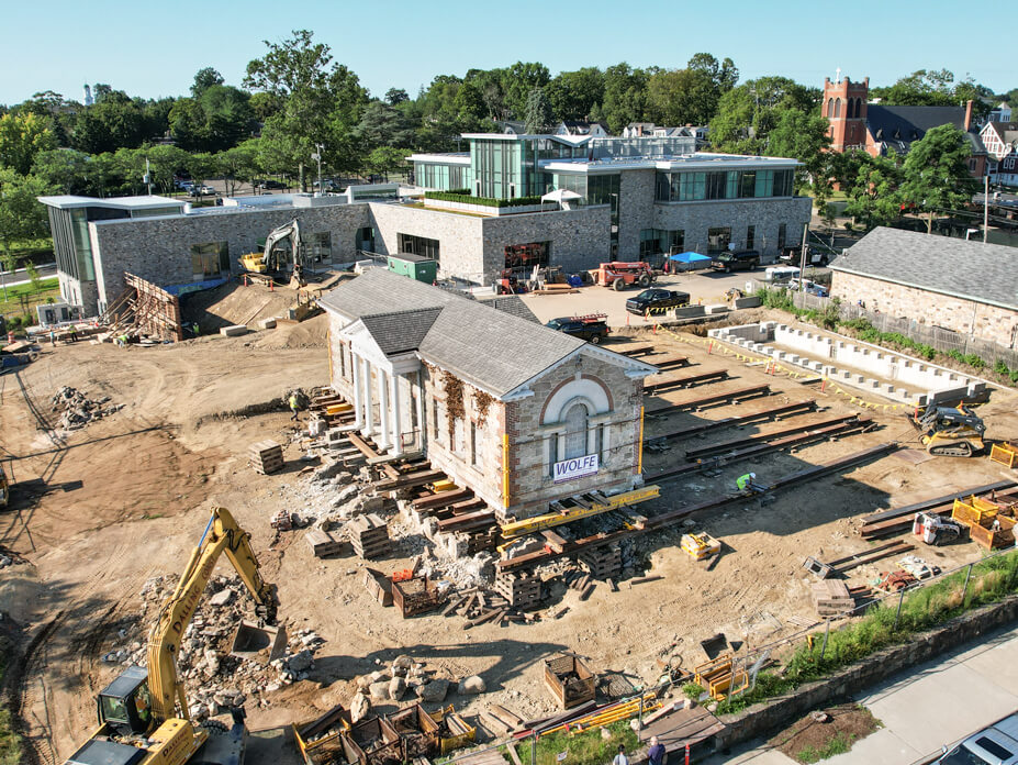 Aerial shot of New Canaan 1913 library building on roll beams with new library in background 