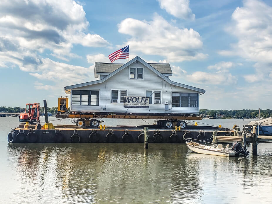 House sits on barge for relocation