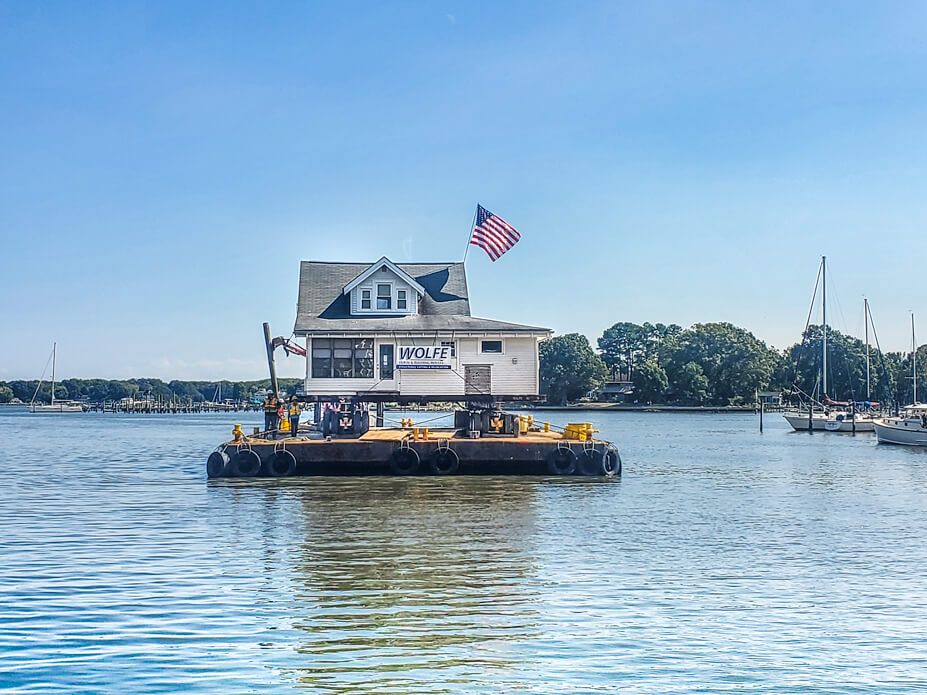 Wolfe House Movers uses barge to move house across West River