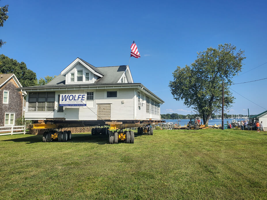 Wolfe drives house across lawn to new location on West River
