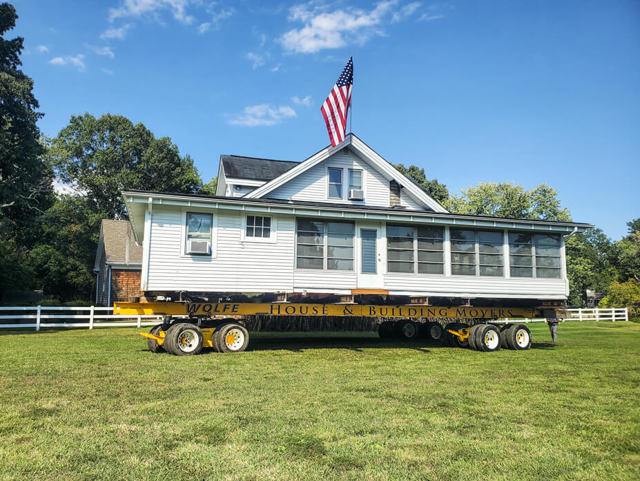 A Maryland home sits on dollies for relocation