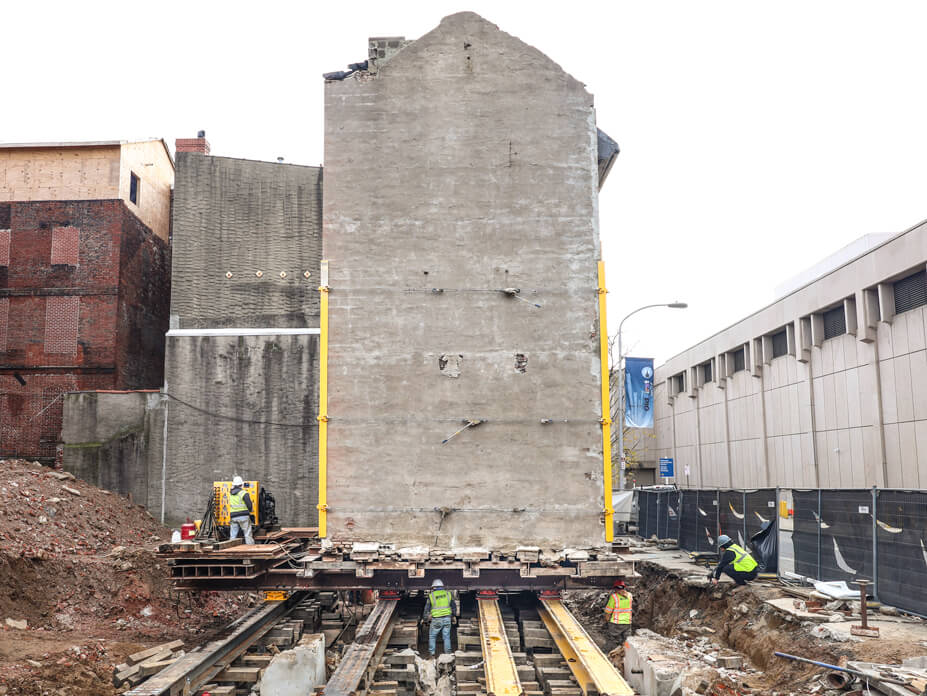 3-story brick row house slides on steel beams