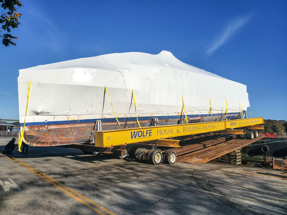 Housemoving dollies drive USS Sequoia onto barge