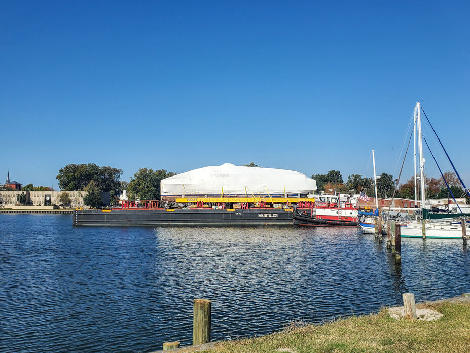 USS Sequoia sits on barge in harbor