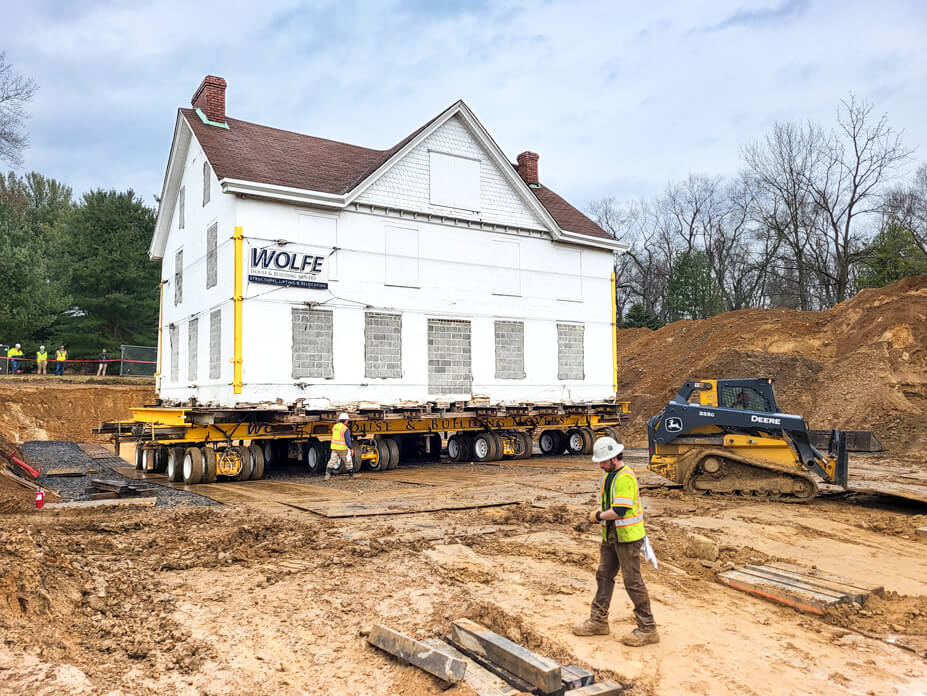 Wolfe personnel move Underground Railway house on dollies