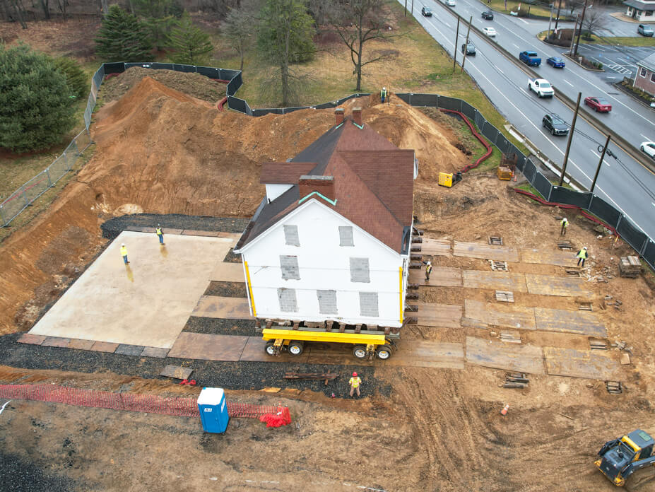 Drone view of Underground Railway house part way across lot to new foundation