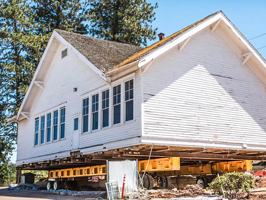 Carus Schoolhouse with dollies and steel beams for relocation