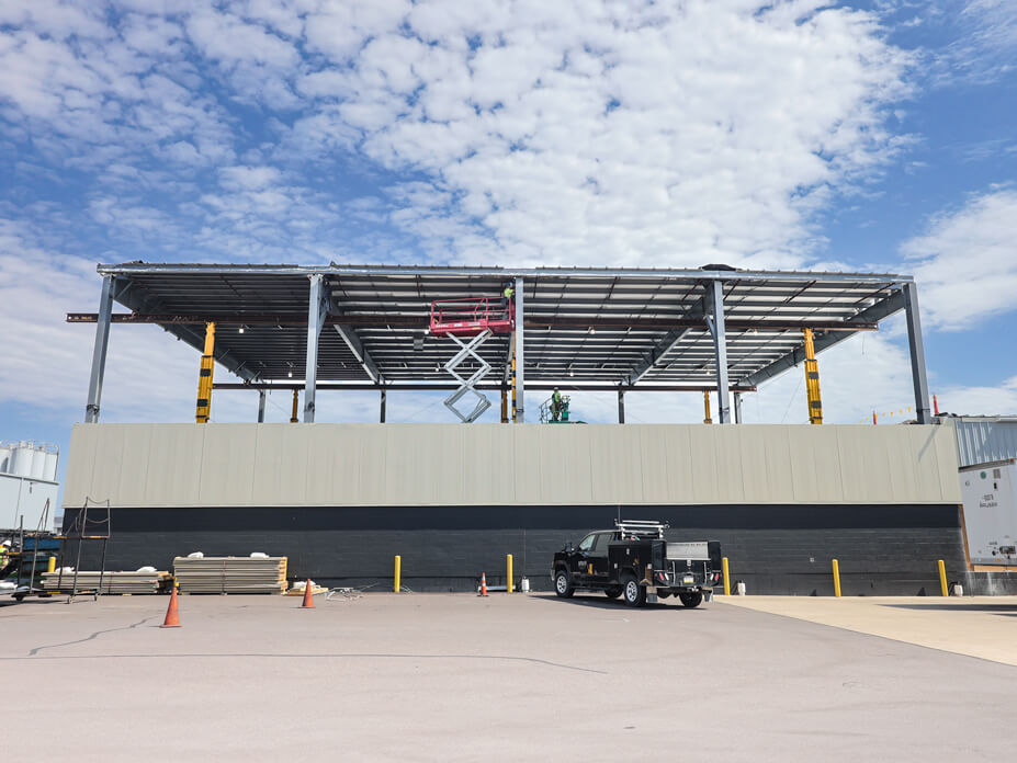 Wolfe House Movers supports 7.500 square feet of warehouse roof during roof lit