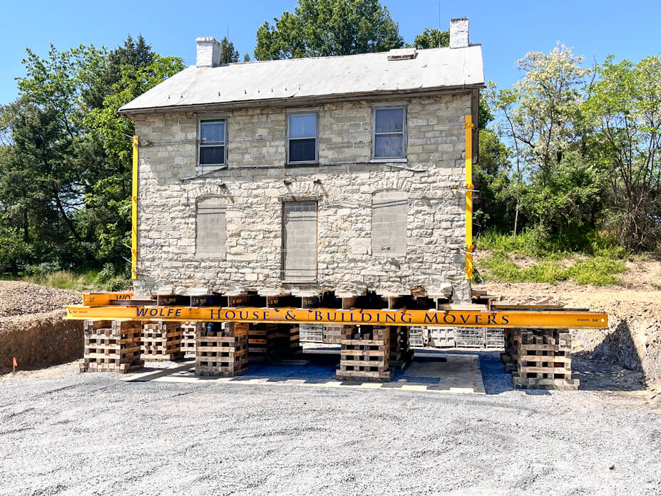 Junkin house sits on cribbing and steel over new foundation