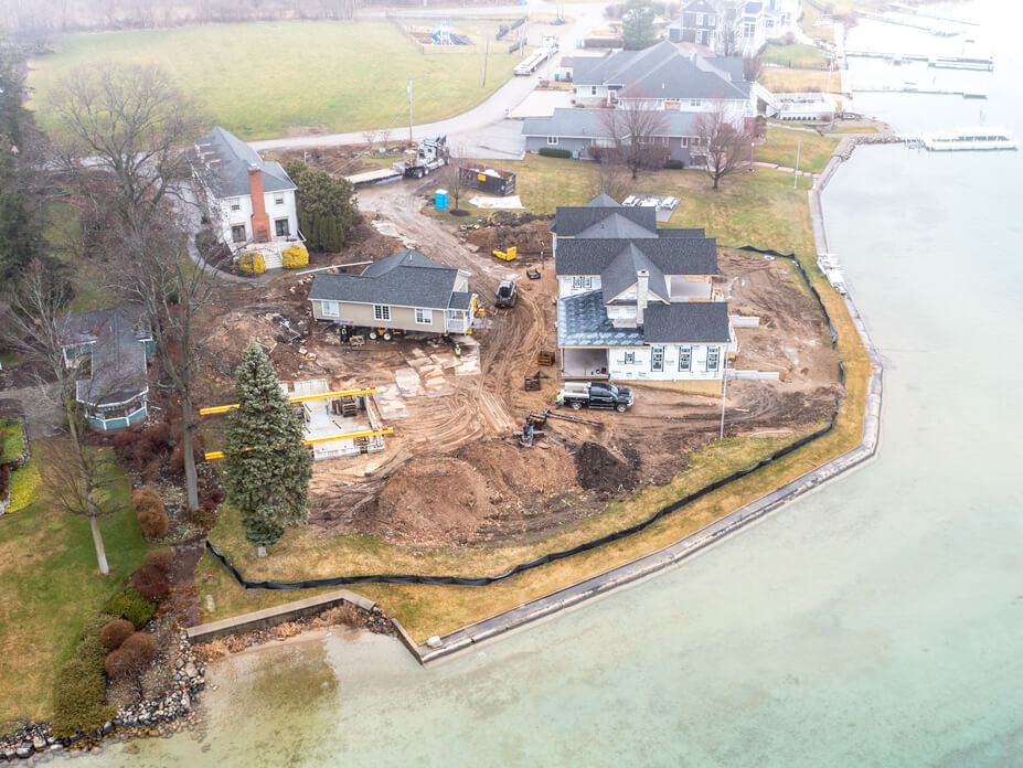 Aerial view of lake cottage being moved to new foundation
