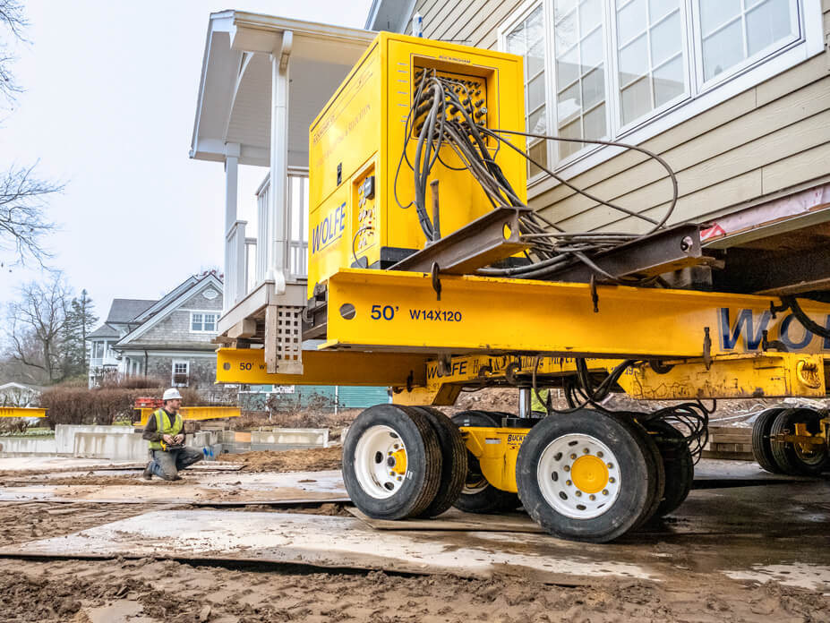 Close up of house moving dolly and power unit for lake cottage relocation