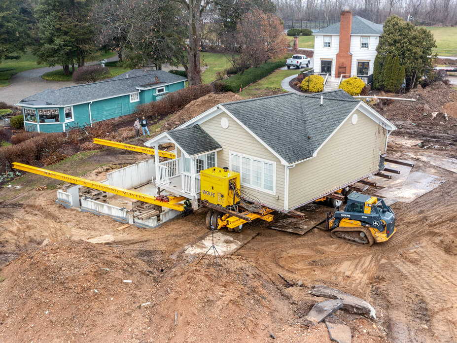Drone shot of lake cottage ready to slide over new foundation