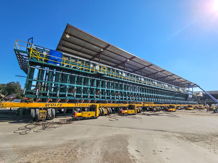 Green lumber sorter with yellow Buckingham unified jacking machines in front of it