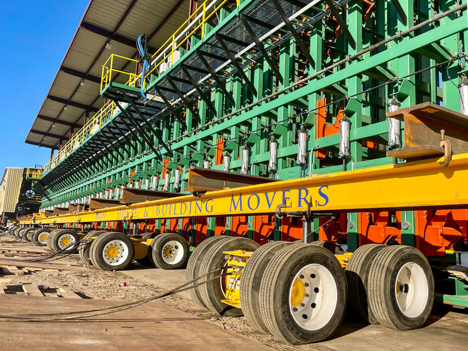 Yellow Buckingham dollies and steel beams under lumber sorter