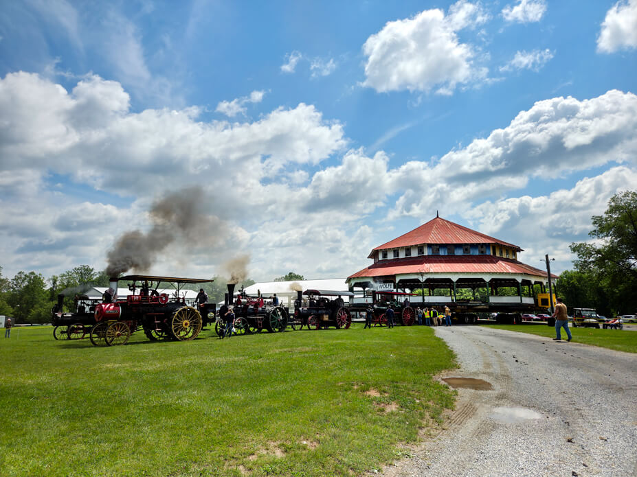 Vintage steam engines complete a ceremonial pull when the carousel house reaches the new location