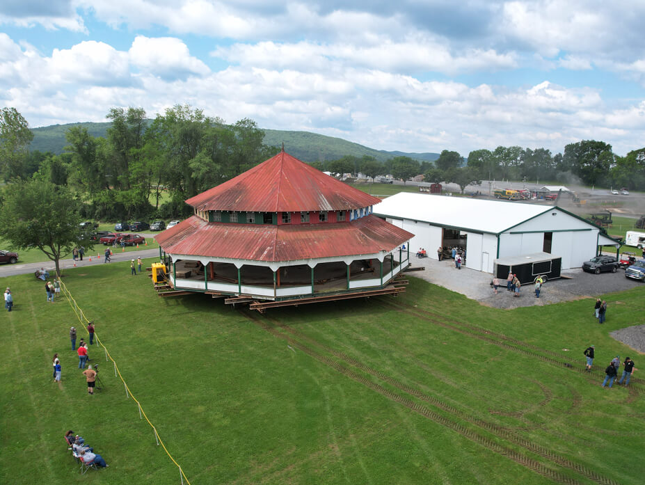 Wolfe drives the carousel house across a yard in preparation for the historic steam engine pull