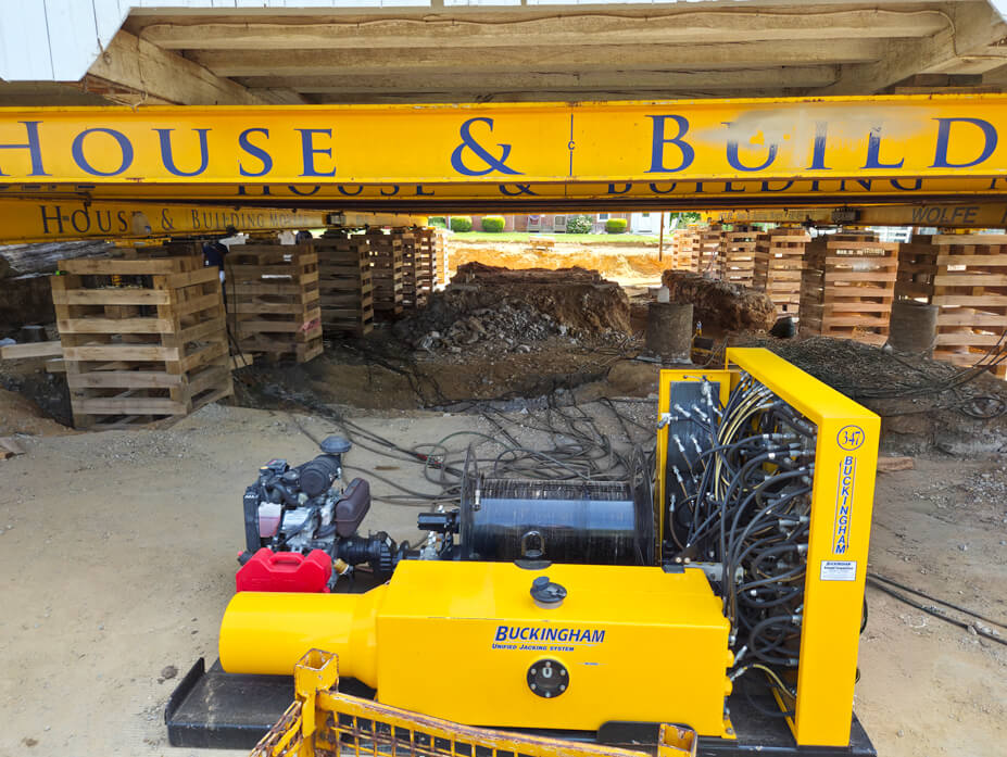 View under lifted barn showing Wolfe Beams and Buckingham Unified Jacking Machine