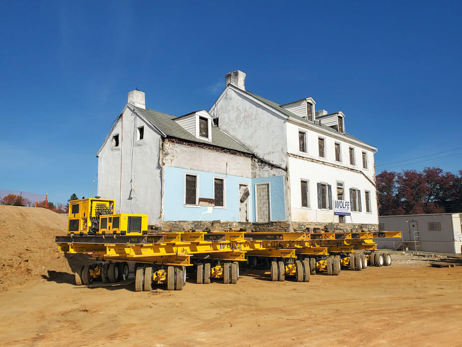 end shot of stone house with wheels under it