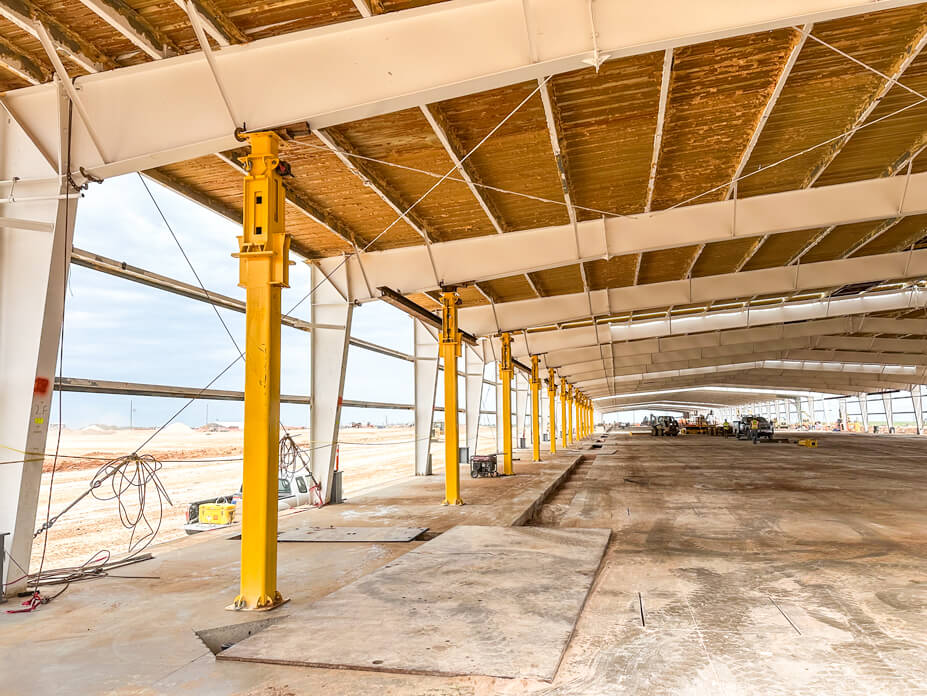 Row of lifting towers in place for roof lift