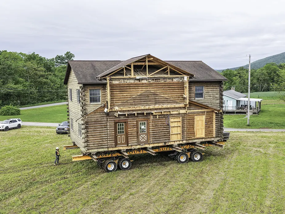 Aerial shot of the home moving through the field