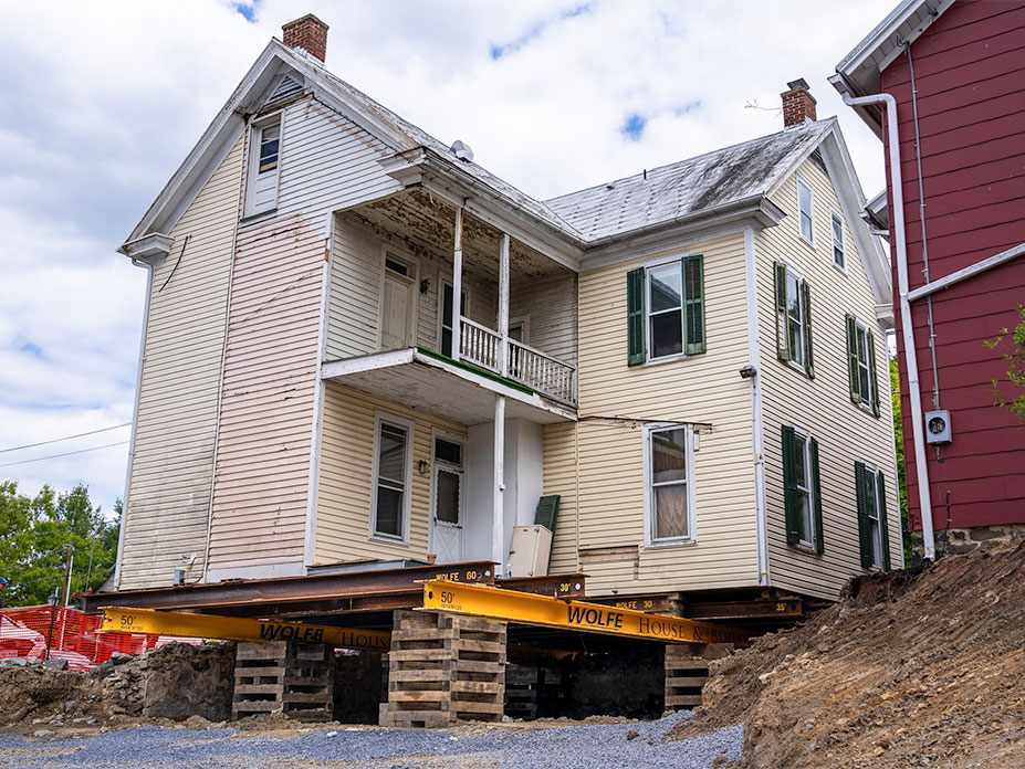 Behind shot of the home with steel and cribbing underneath.